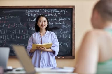 Young Successful Female Student with Open Book